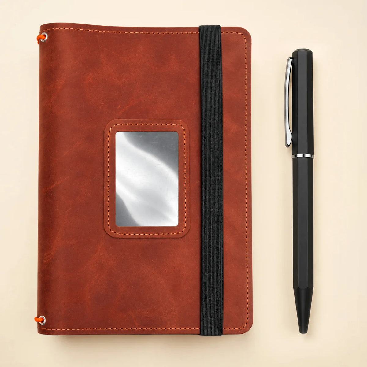 Handmade leather journal cover featuring practical inner pockets and three elastic bands.