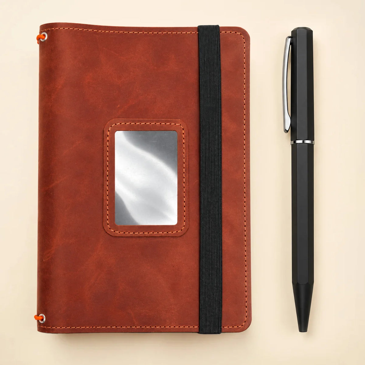 Handmade natural leather notebook cover with pockets inside and three elastic bands.