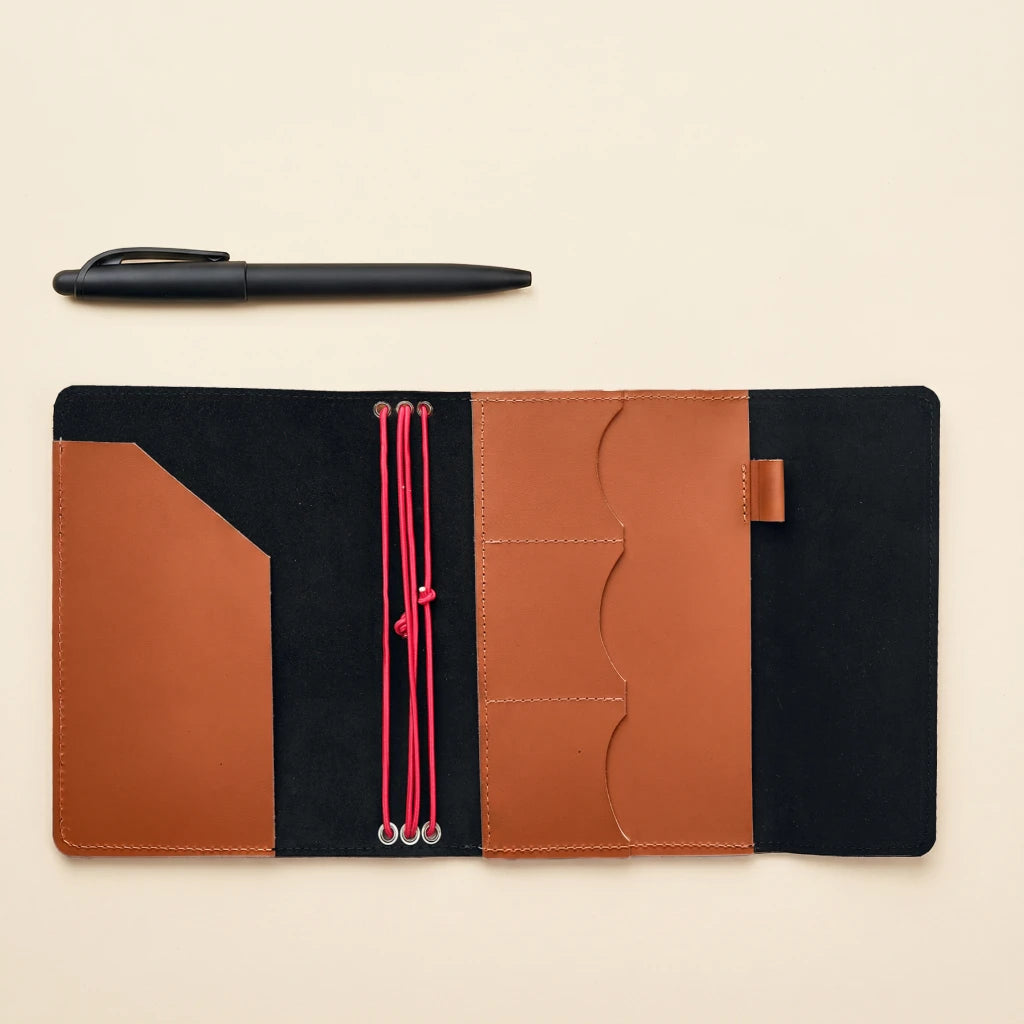 Handmade leather planner cover with elastic straps and timeless design