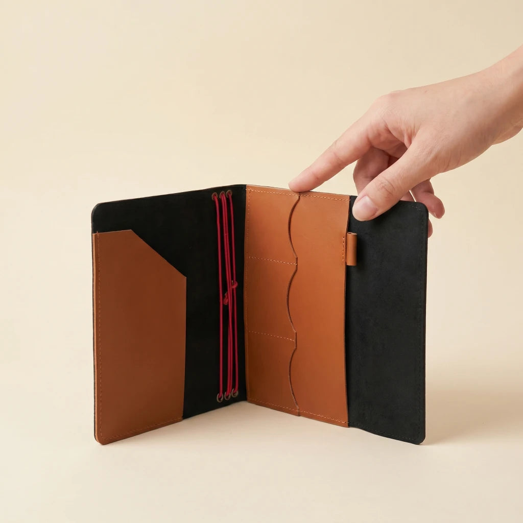 Refillable leather journal cover with elastic closure and natural leather texture