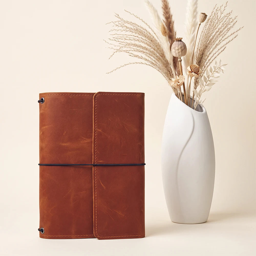 Leather notebook wrap featuring handcrafted quality and interior organization for everyday carry.