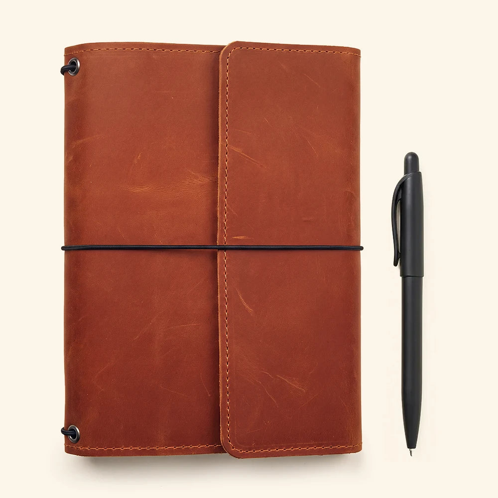 Elegant handcrafted leather journal organizer with secure notebook elastics and storage compartments.