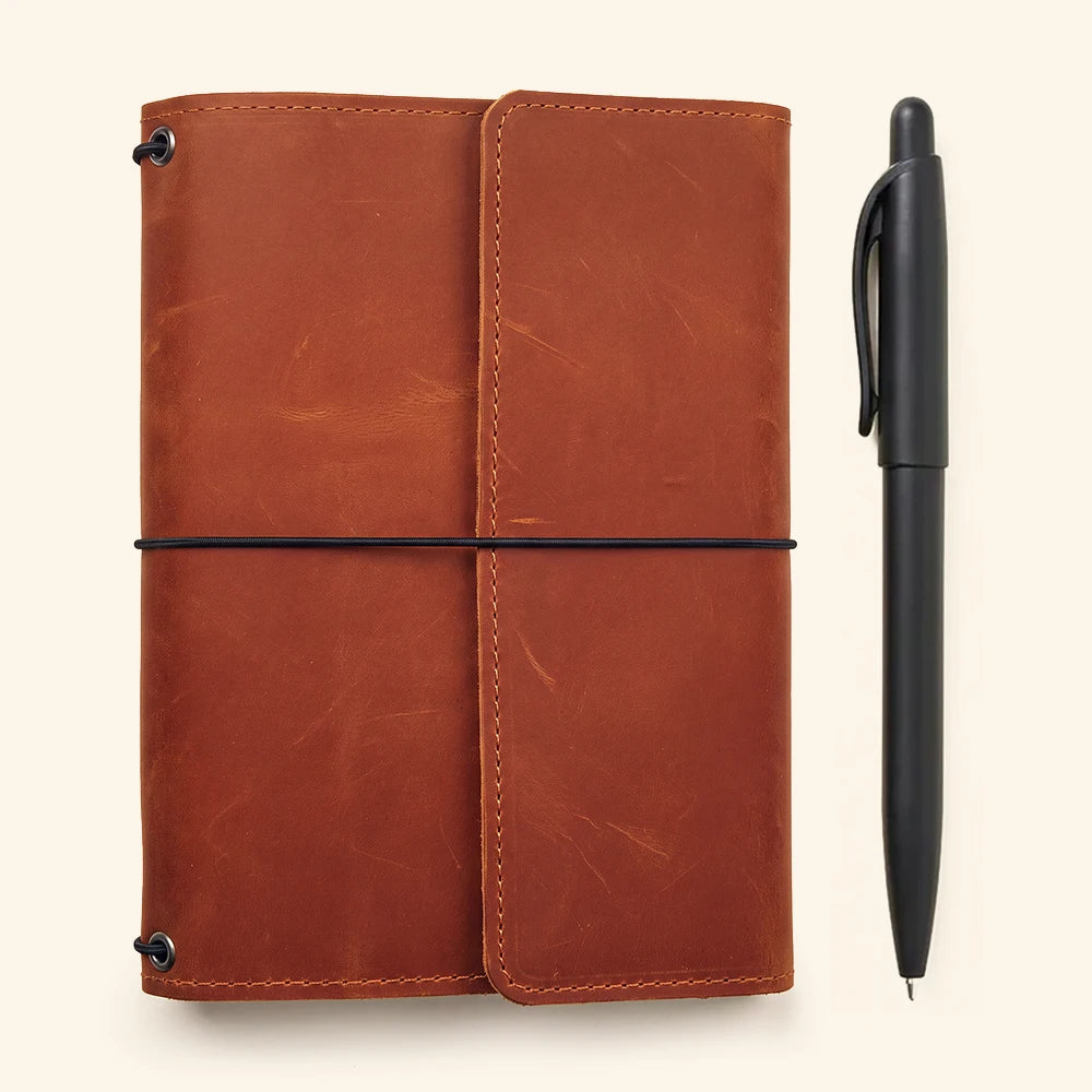 Premium leather journal organizer with three elastic bands and multiple interior compartments.