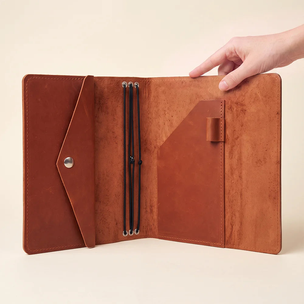 Refillable leather planner cover crafted for writers, travelers, and daily productivity enthusiasts.