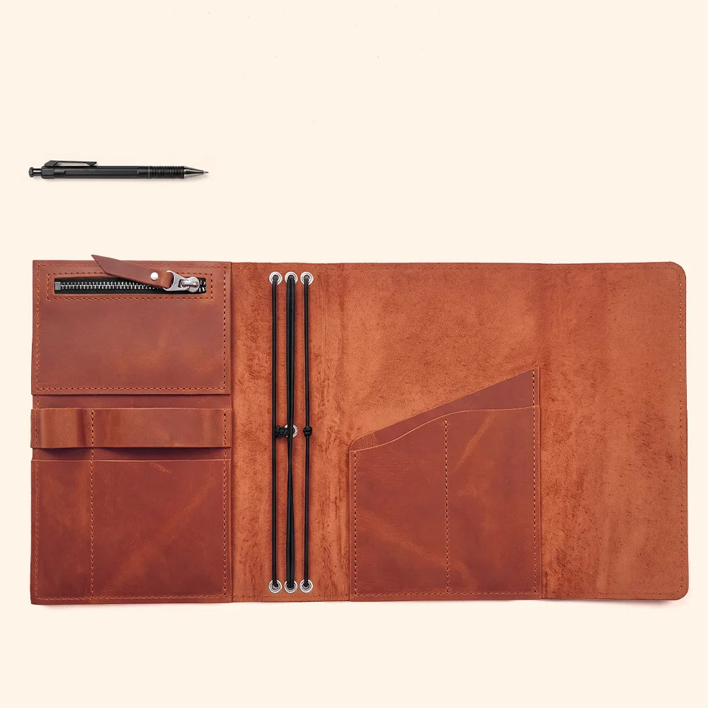 Leather notebook cover showing refined craftsmanship, useful compartments, and a dedicated pen loop.