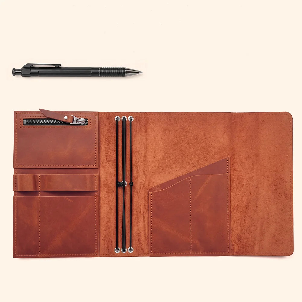 Rustic leather notebook cover with inner compartments and a dedicated loop for pens