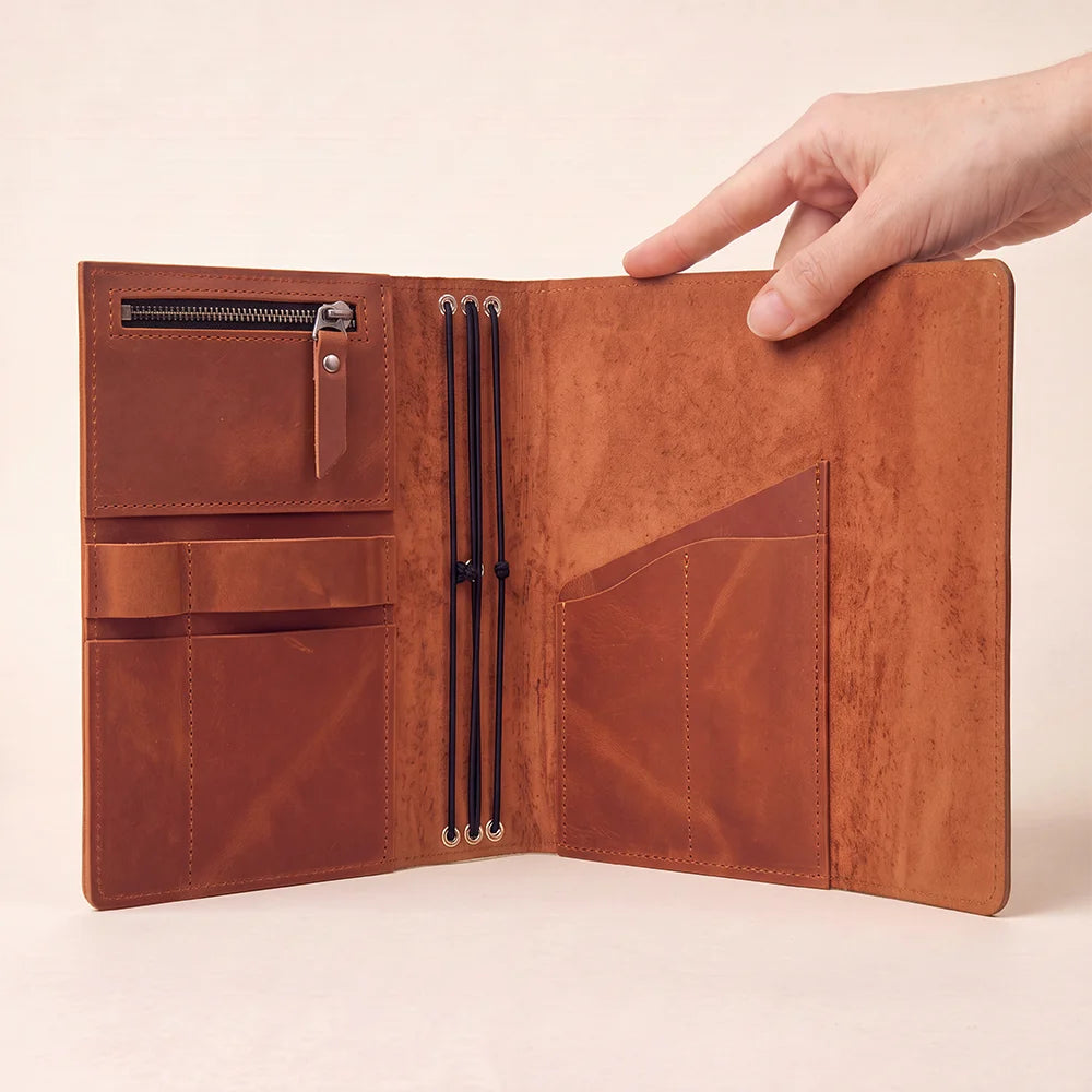 Natural leather journal cover with functional compartments and dedicated space for pens