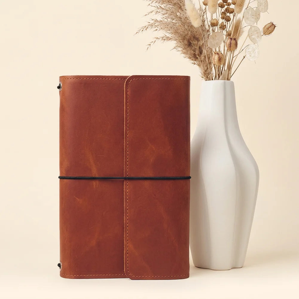 Genuine leather journal organizer featuring dedicated compartments for cards, notes, and writing instruments.