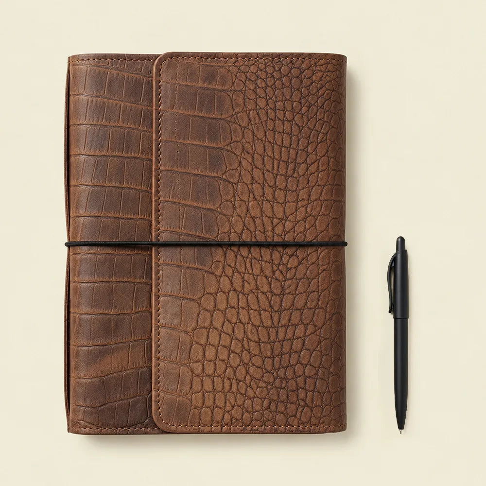 Handmade genuine leather cover with small pockets and large zippered storage space.