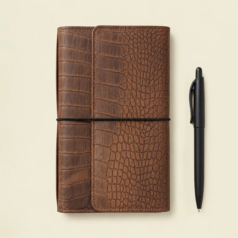 Premium genuine leather notebook cover with small pockets and secure zipper compartment.