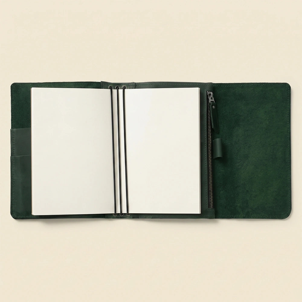 Timeless leather notebook organizer with refillable inserts and card pockets.