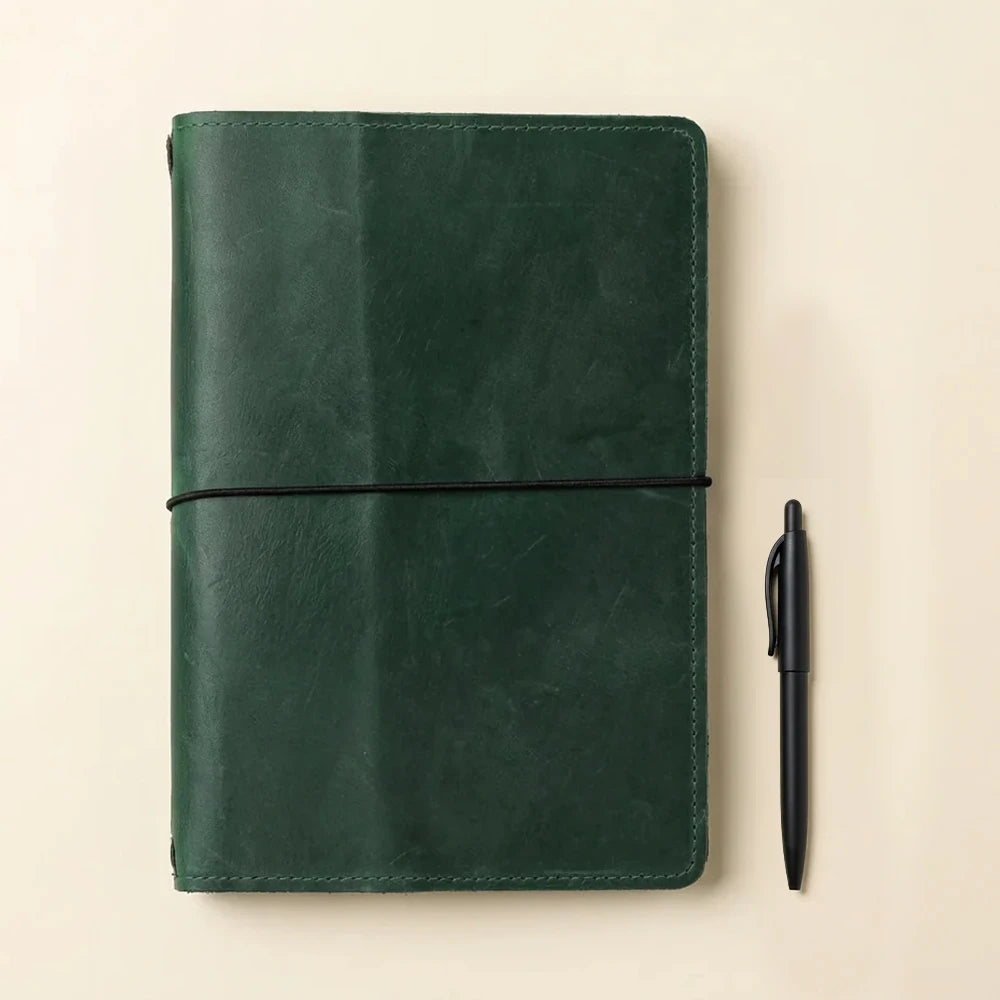 Leather writing organizer with refillable notebook elastics and premium handcrafted leather construction.