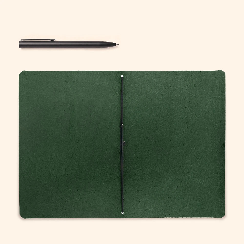 Handmade leather writing wrap with a plain notebook for thoughts and reminders.