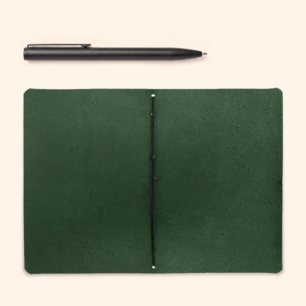 Stylish genuine leather notebook cover with one elastic band and plain notebook insert.