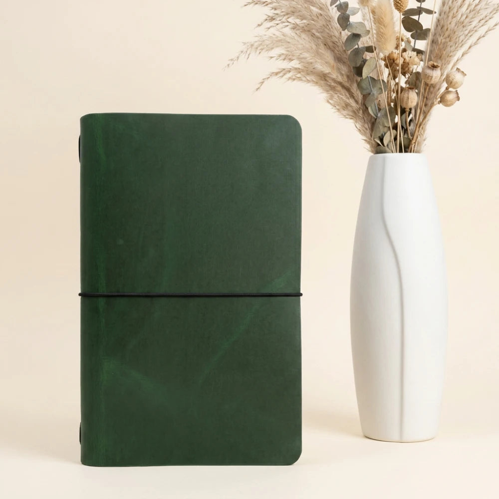 Genuine leather journal sleeve highlighting smooth edges and practical notebook retention.