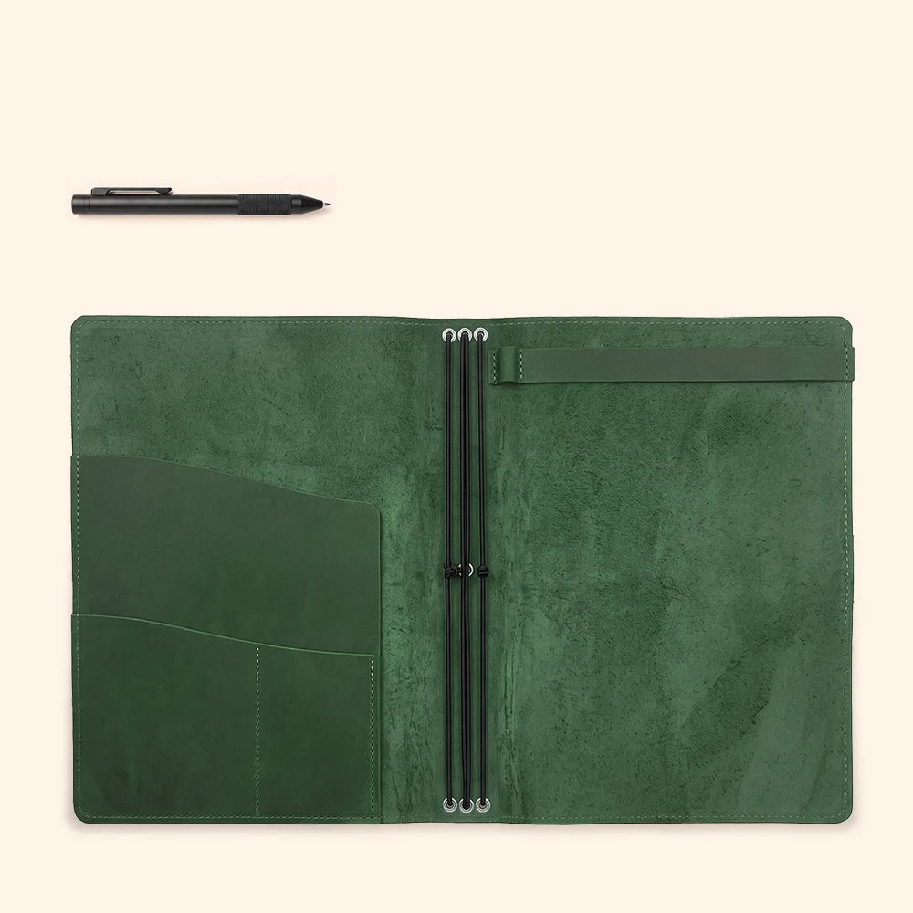 Leather notebook organizer opened flat, revealing storage pockets and flexible retaining bands.