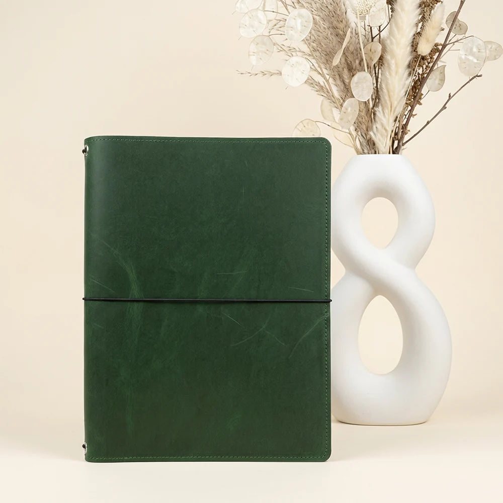 Handmade genuine leather cover for organizing several notebook inserts in one compact case.