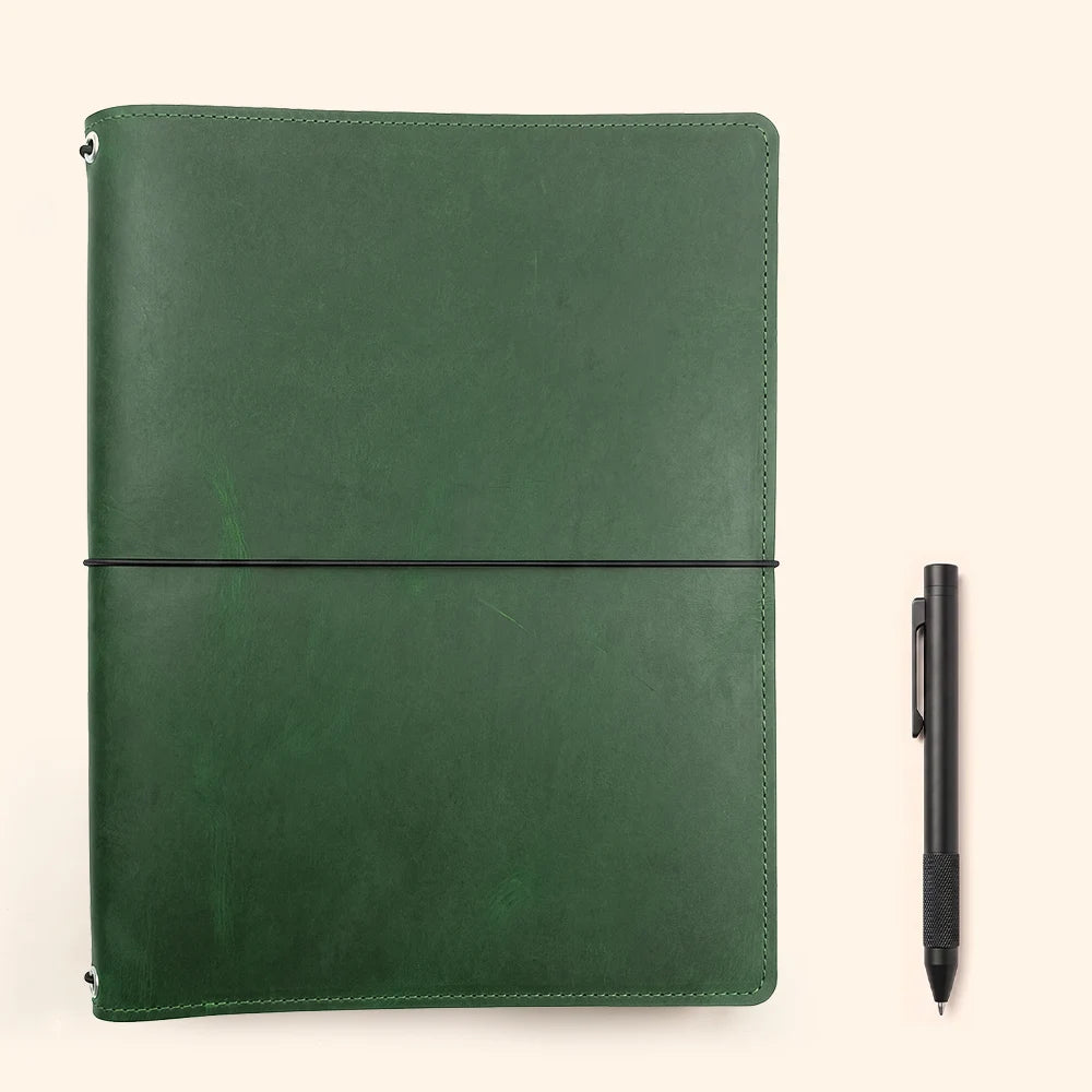 Genuine leather organizer with elastic bands for securely carrying interchangeable notebooks.