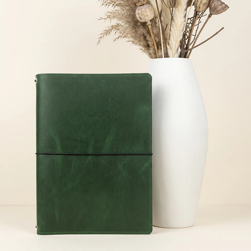 Natural leather journal cover designed to keep several notebooks together in one place.
