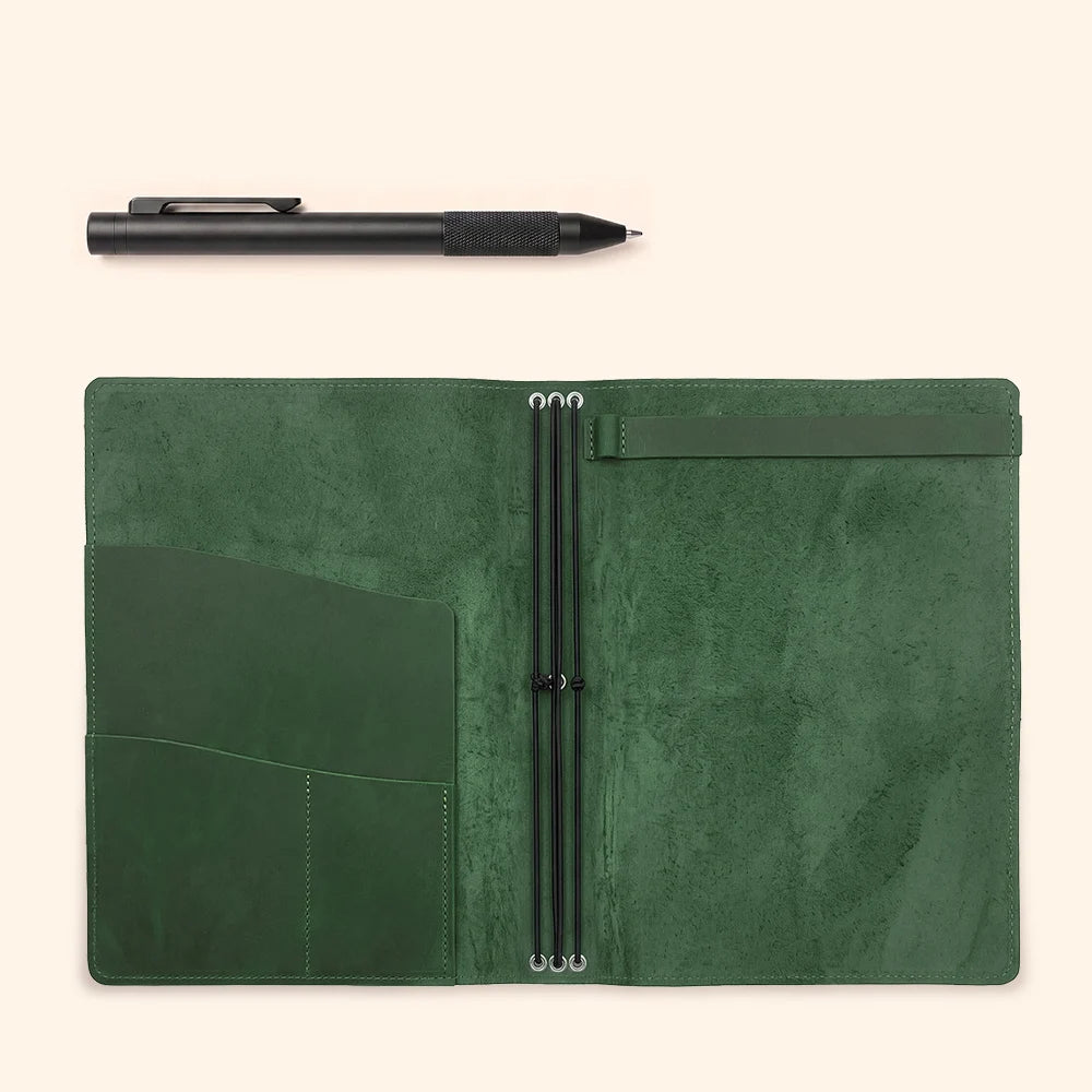 Handmade leather notebook wrap offering organized pockets and secure flexible attachments.