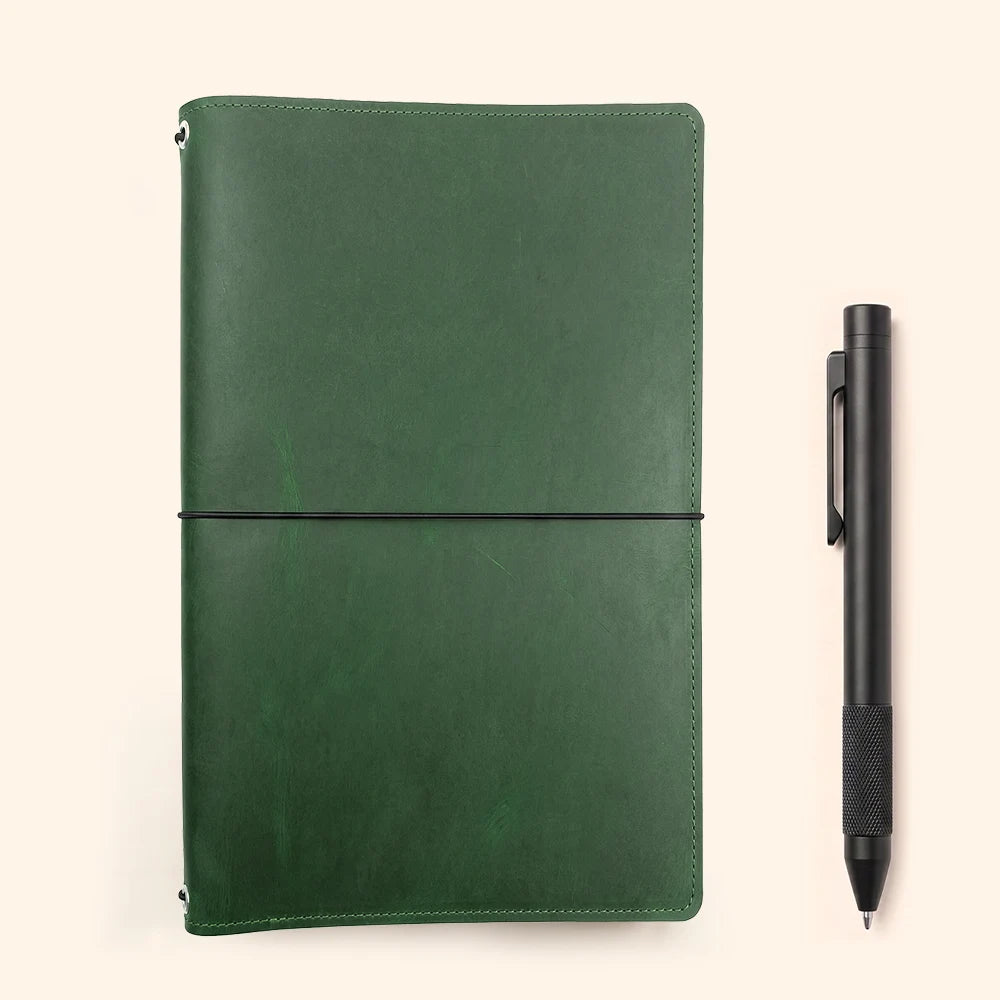 Leather notebook sleeve with a structured interior for sketchbooks and interchangeable inserts.