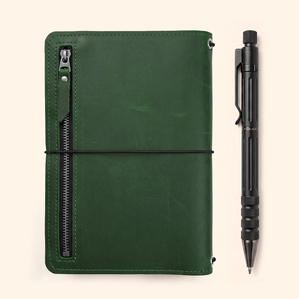 Leather journal cover designed with inside card pockets and integrated leather pen loop.