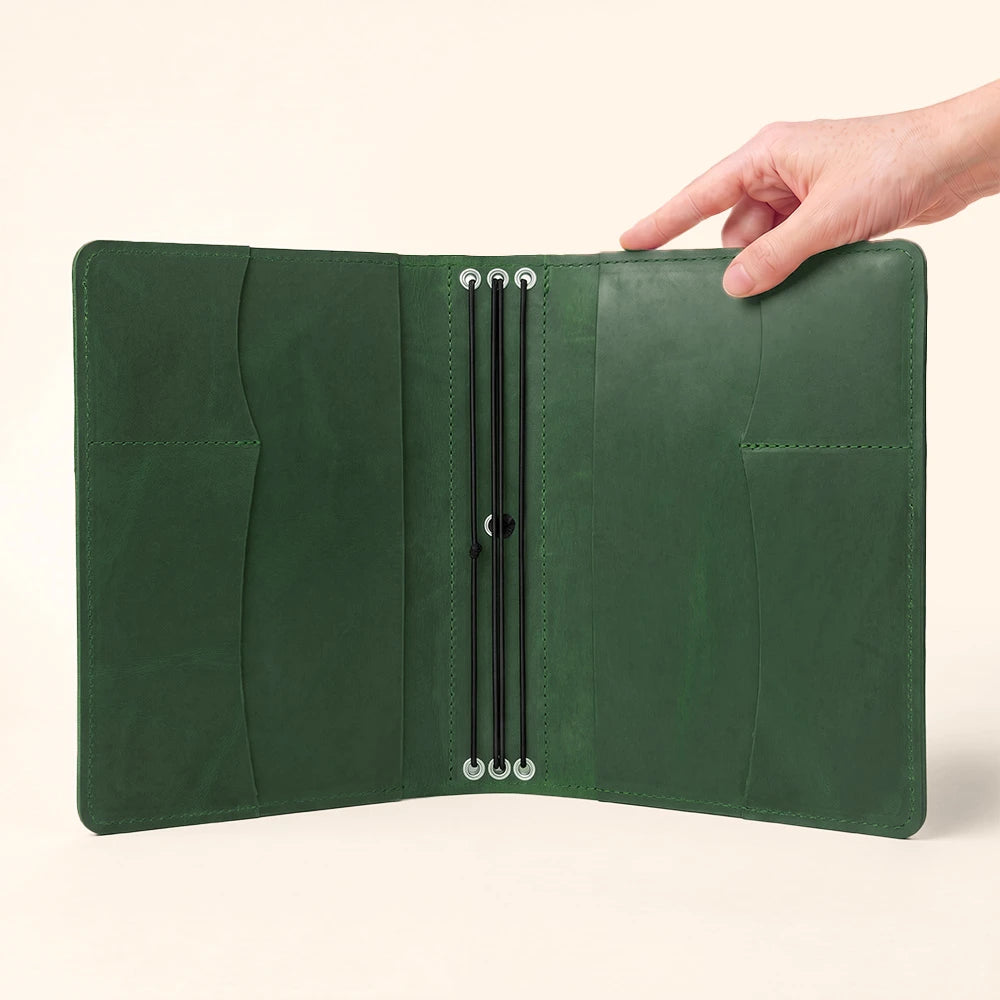 Leather notebook cover with organized inner sleeves for papers, cards, and stationery.