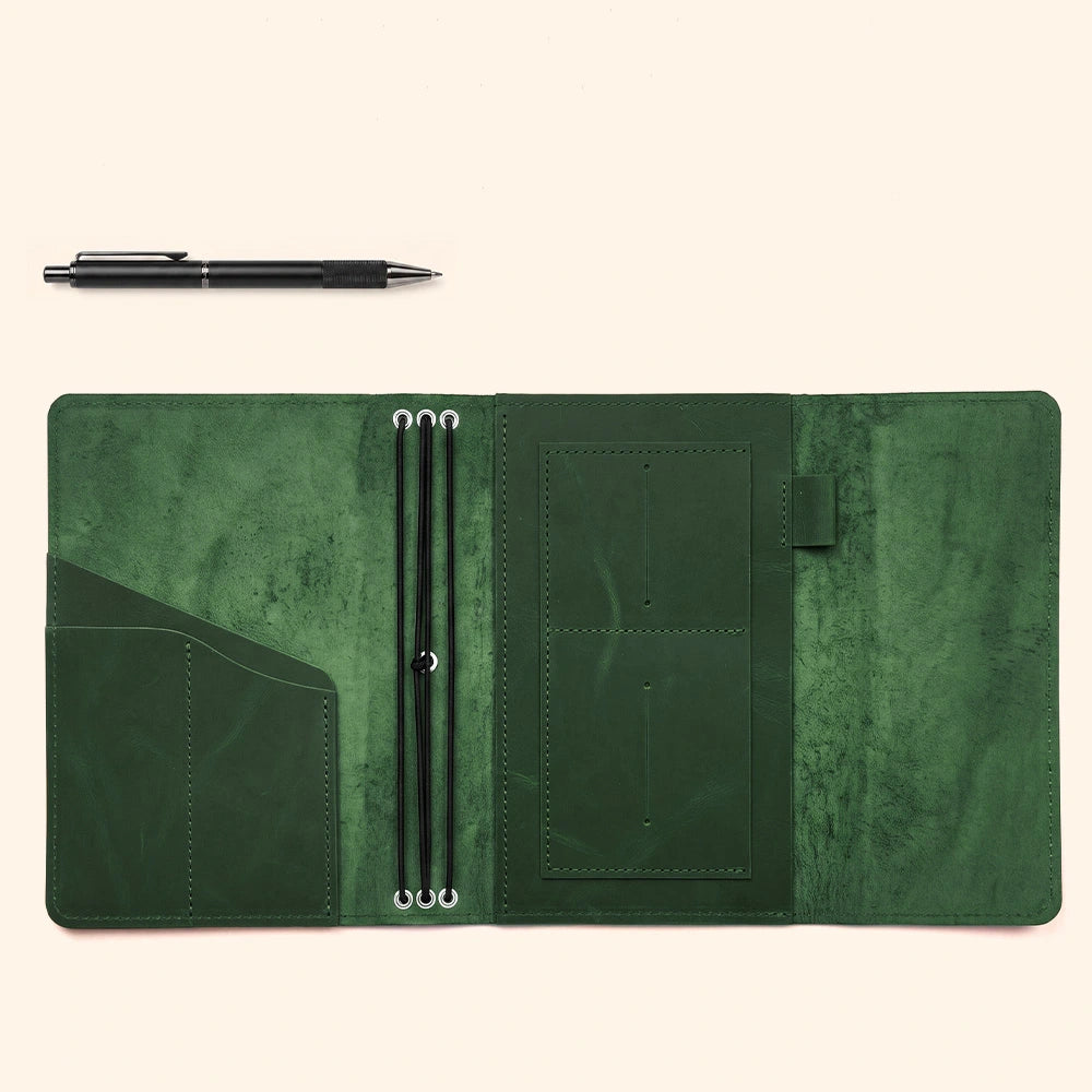 Leather notebook folio organizer with stitched compartments and integrated leather writing loop.