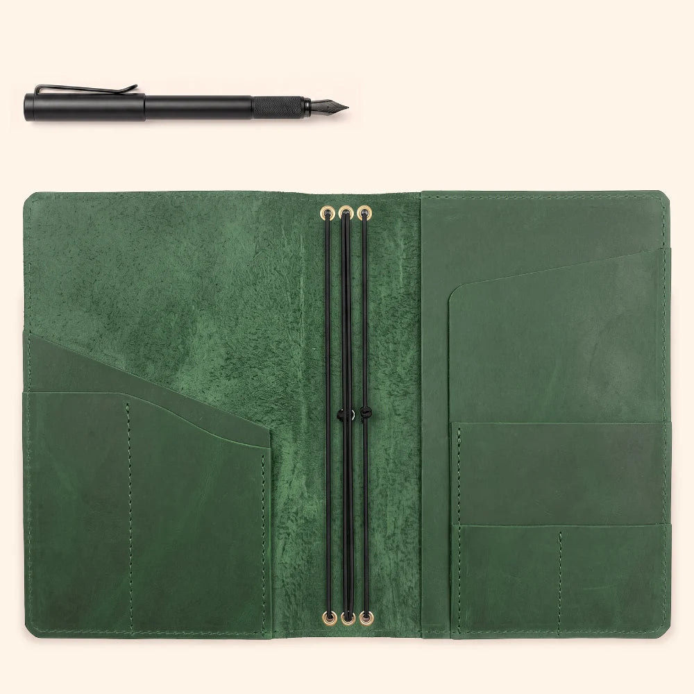 Handmade leather cover providing organized storage for three paper inserts.