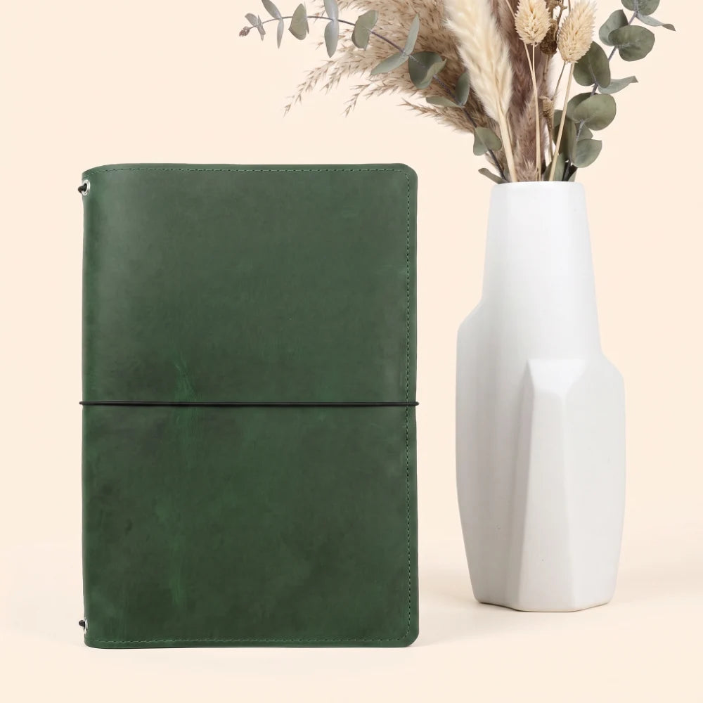 Handmade refillable leather cover featuring three flexible interior elastic loops.