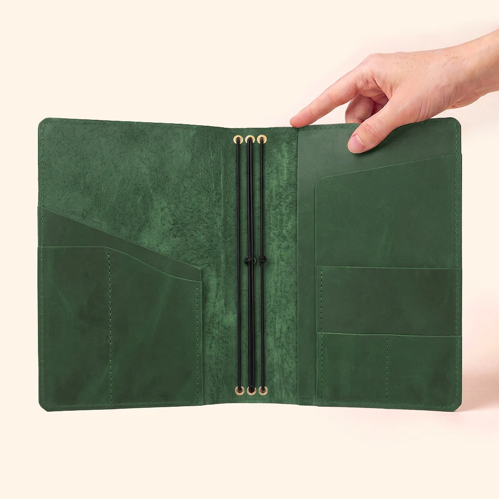 Handmade natural leather cover featuring three elastic loops for multiple notebooks.