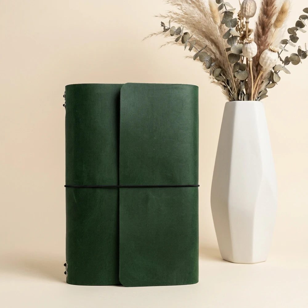 Genuine leather journal wrap designed for six removable writing inserts and accessories.