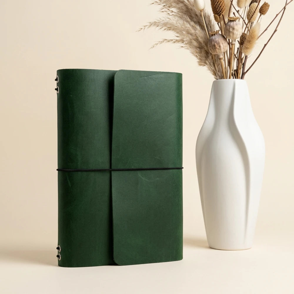 Genuine leather notebook portfolio supporting six refill inserts for organized daily writing.