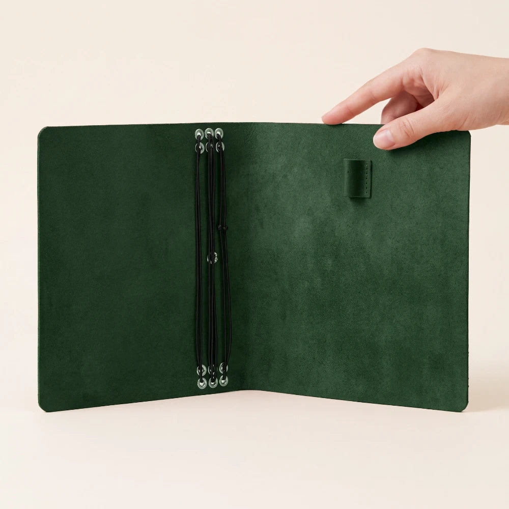 Classic natural leather planner organizer designed for six refillable notebook inserts.
