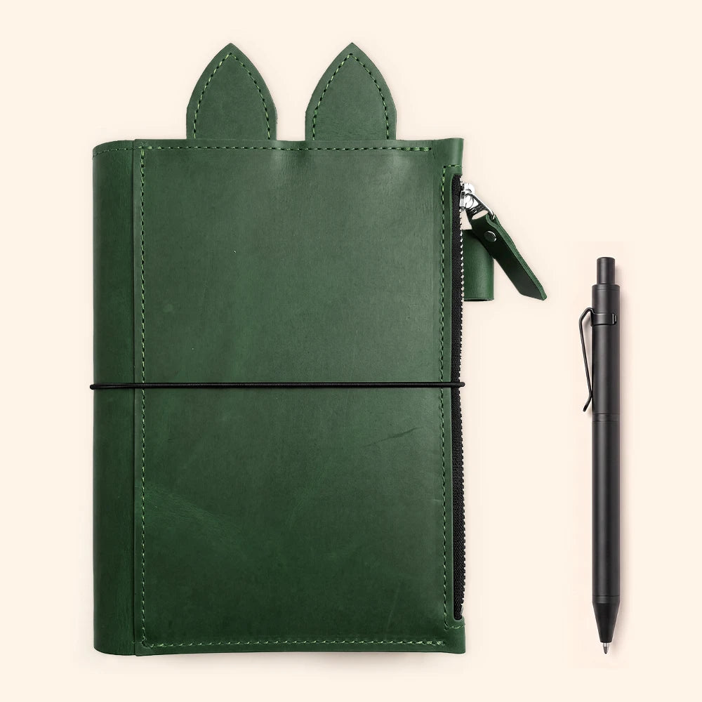 Leather notebook cover combining whimsical accents with a clean organized interior.