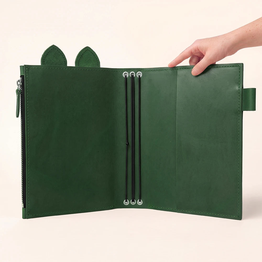 Leather writing organizer opened wide to reveal its handcrafted functional design.