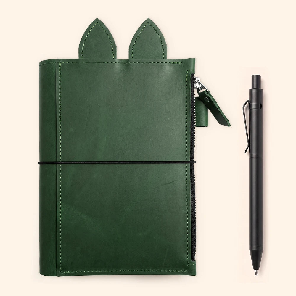 Handmade planner organizer with zipper compartment, pen loop, and playful leather ears.