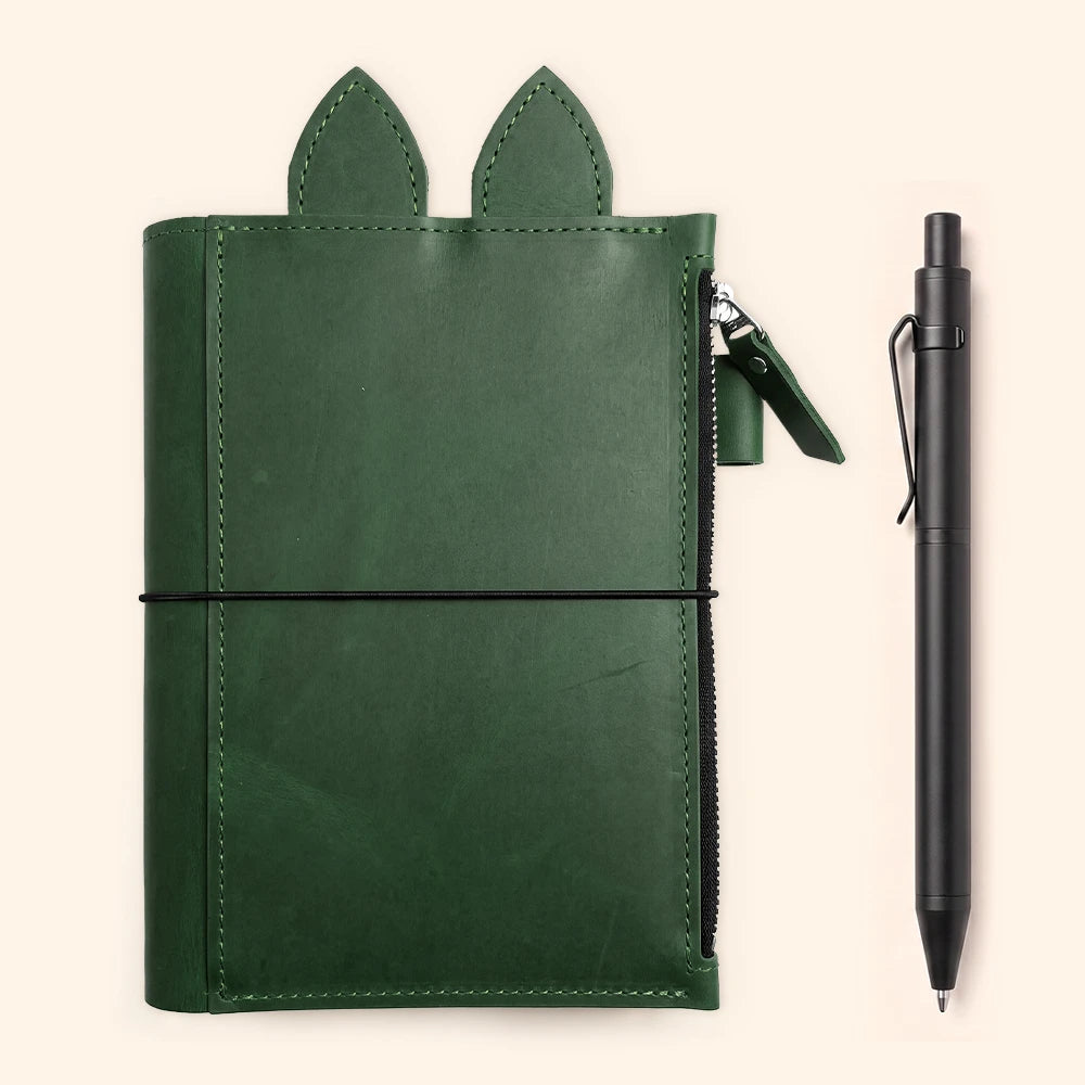 Leather planner organizer with spacious zipper compartment, pen loop, decorative leather ears, and three elastics.