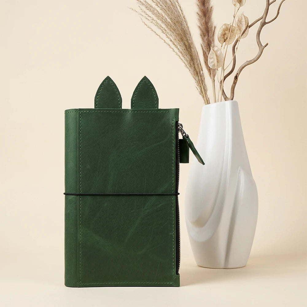 Leather writing organizer featuring a full-size zipper pocket for everyday essentials.