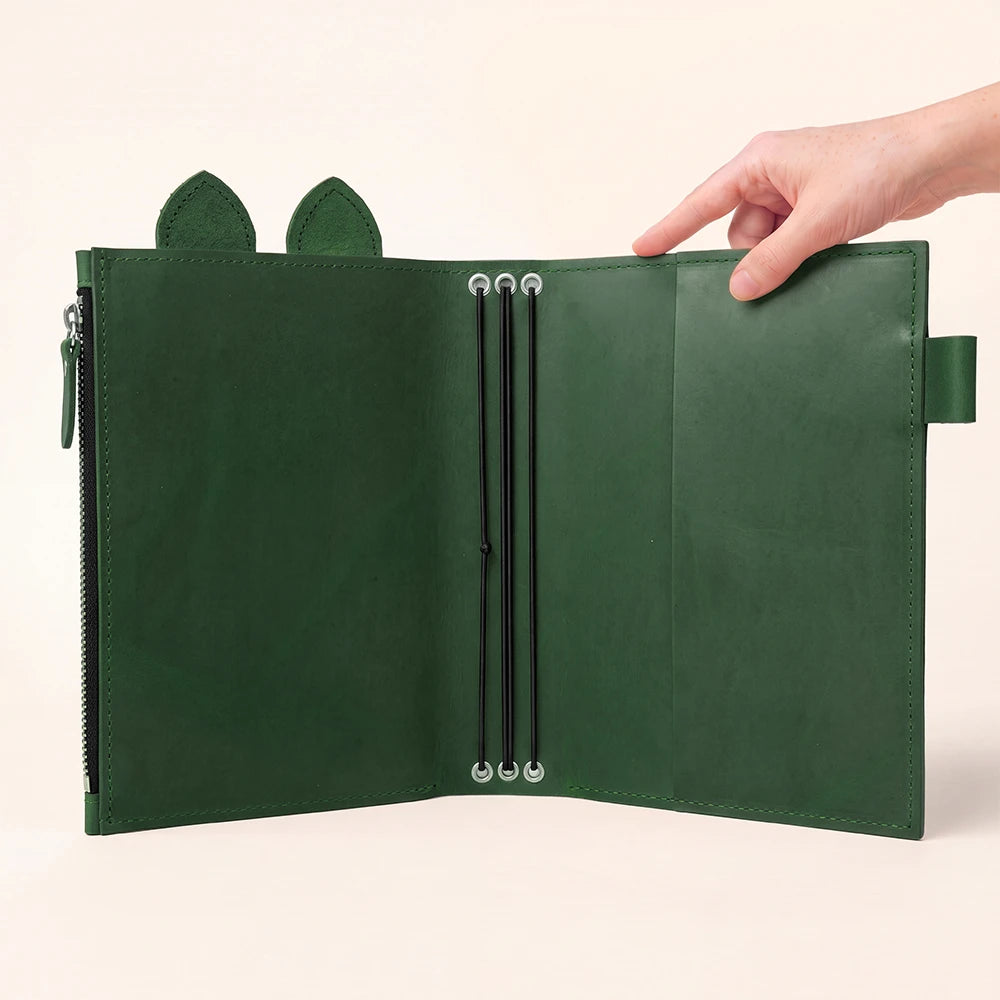 Open genuine leather cover with neatly aligned elastic cords through silver eyelets.