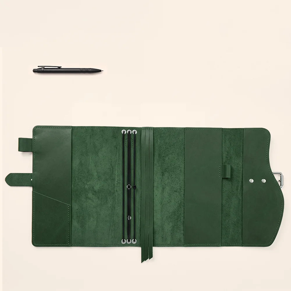 Premium leather notebook carrier featuring organized compartments, pen loop, ribbon bookmark, and convenient outside grip.