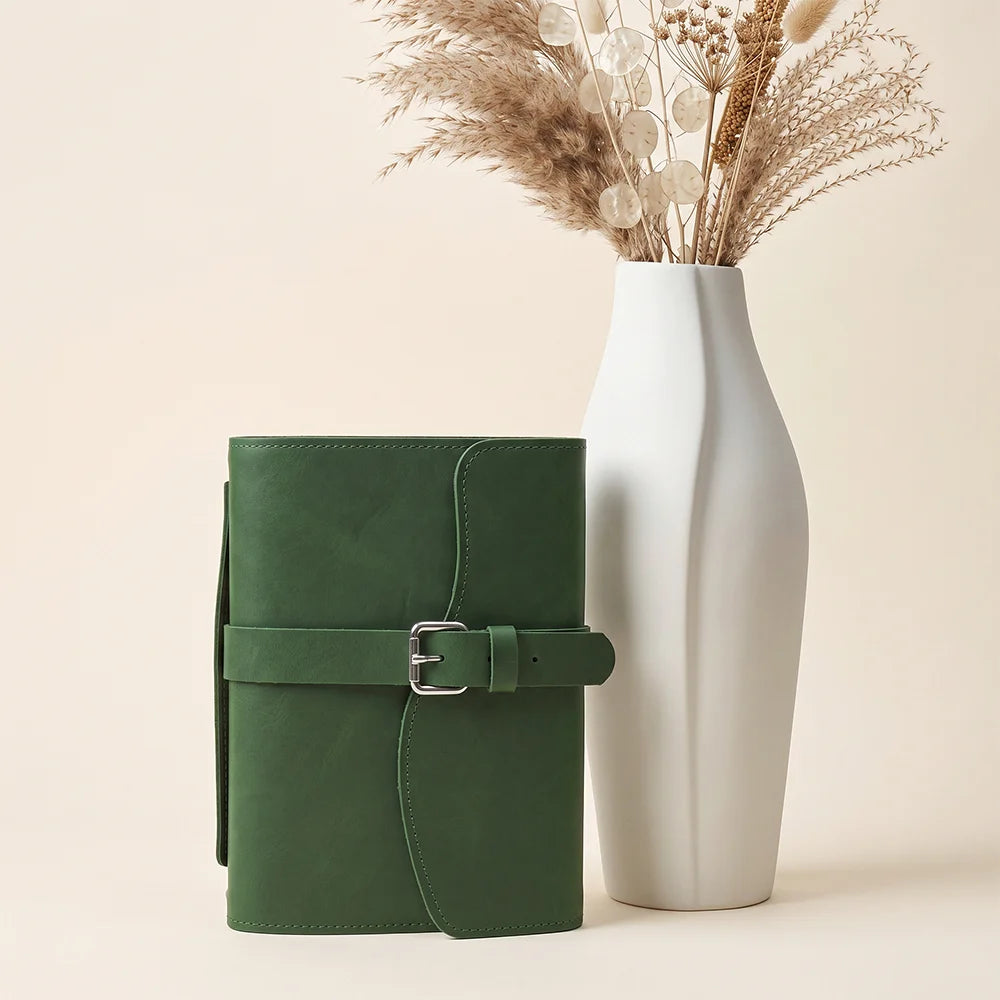 Handmade leather writing organizer with interior pockets, pen loop, page marker, and practical carrying handle.