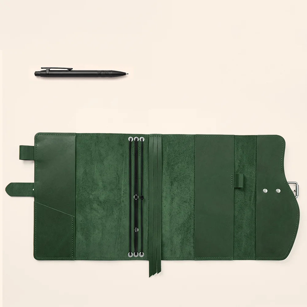 Natural leather notebook wrap with functional compartments, pen loop, page marker, and external carrying grip.