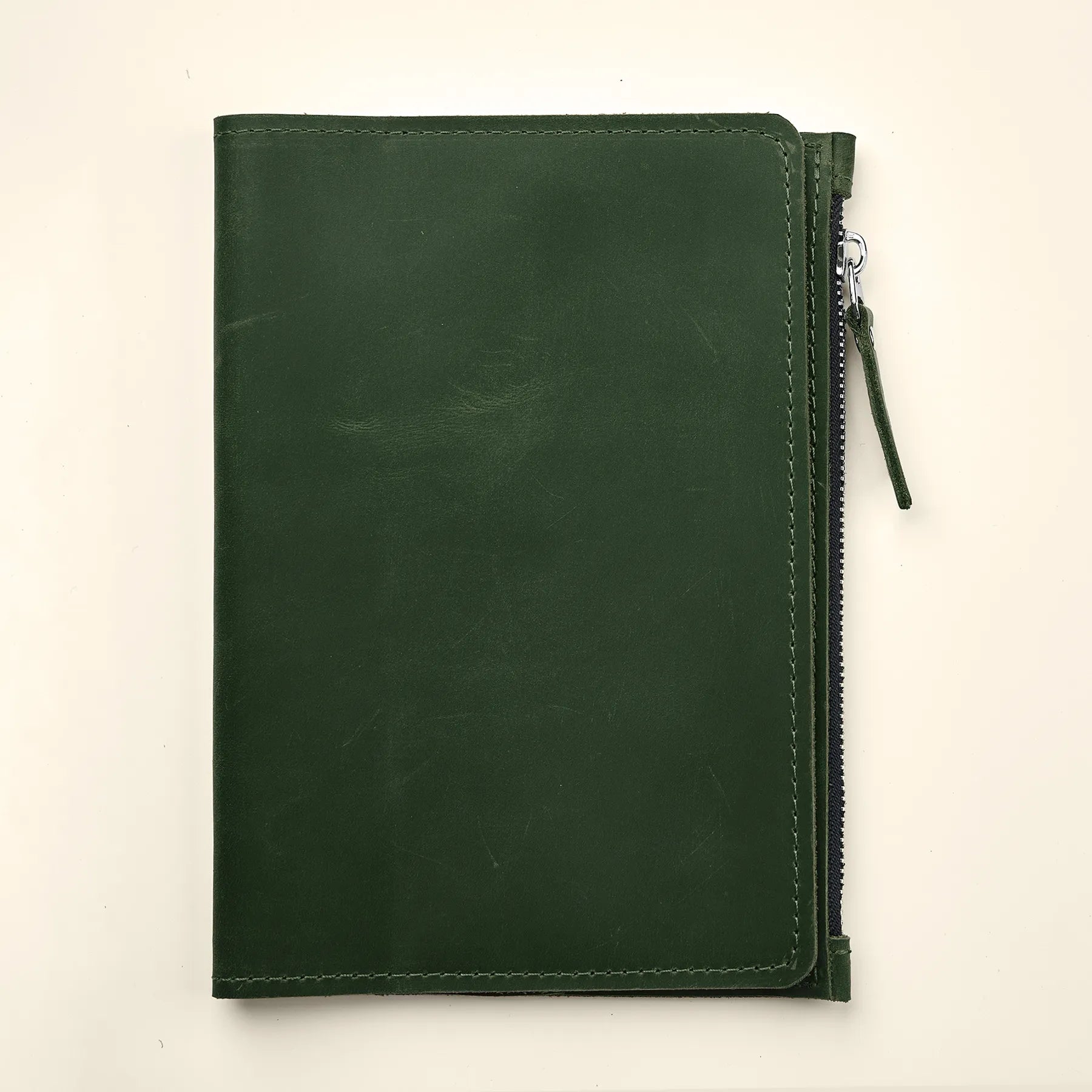 Handmade leather notebook accessory insert with convenient card and document pockets.
