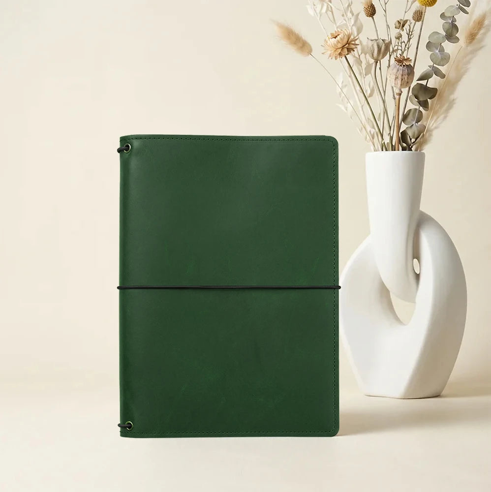 Leather notebook folio with practical organization, elastic holders, and premium leather finish.