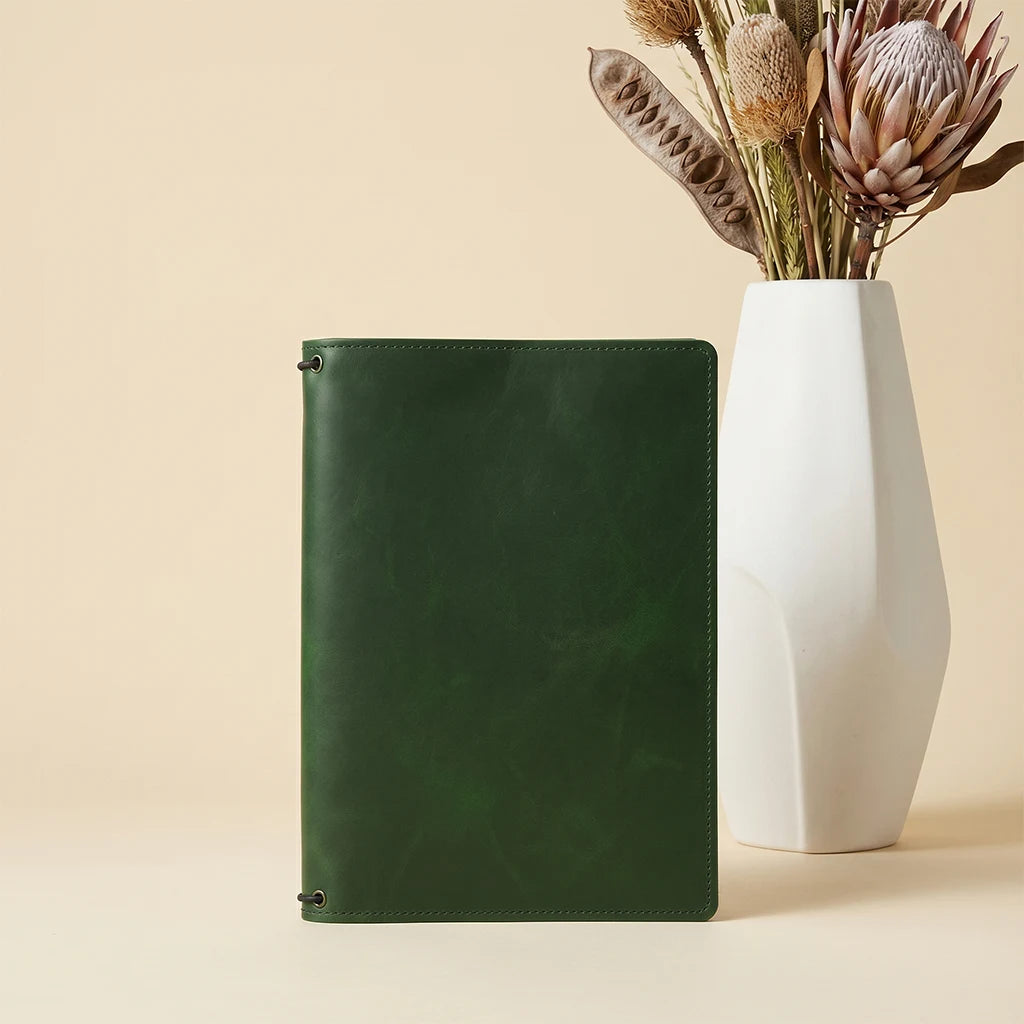 Premium leather journal cover with storage pockets and three elastics.