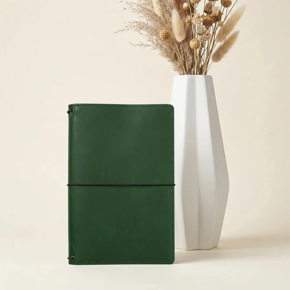 Leather notebook case with refillable elastic bands and functional card storage compartments.
