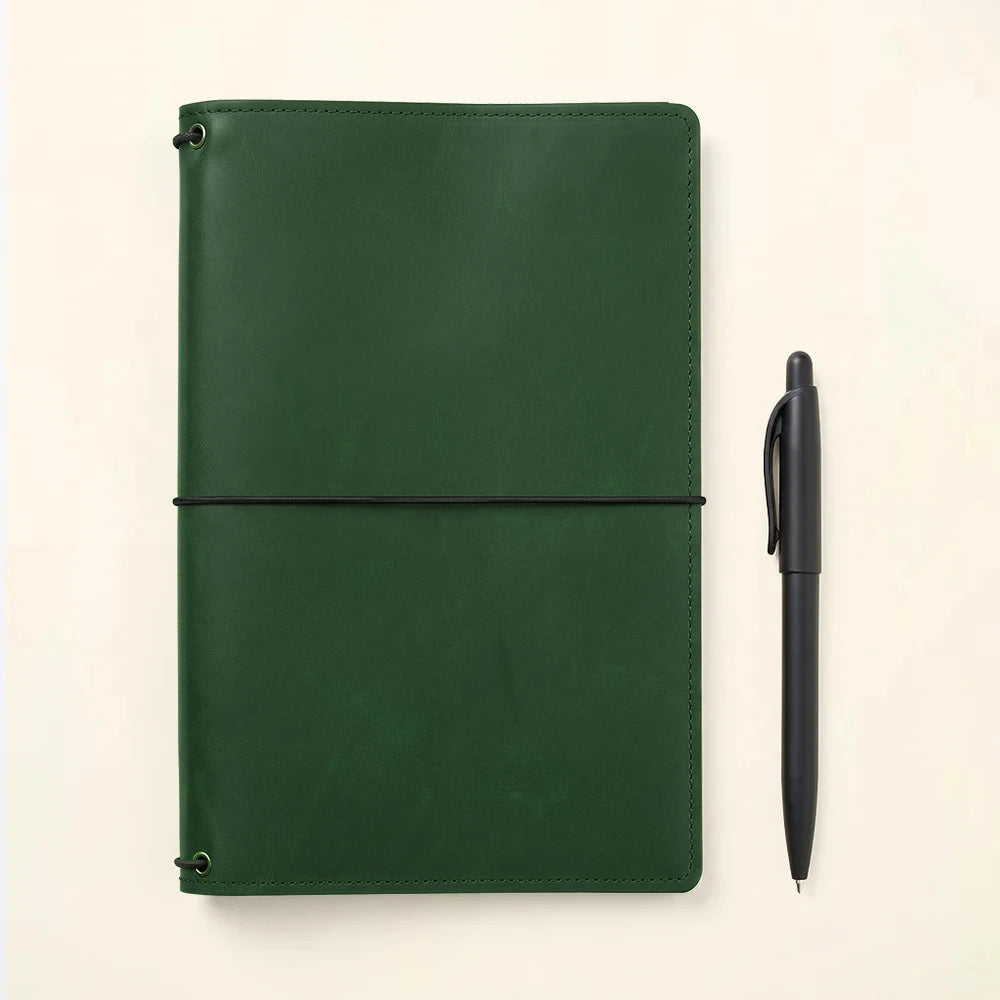 Durable leather notebook cover with refillable design and convenient inside card pockets.
