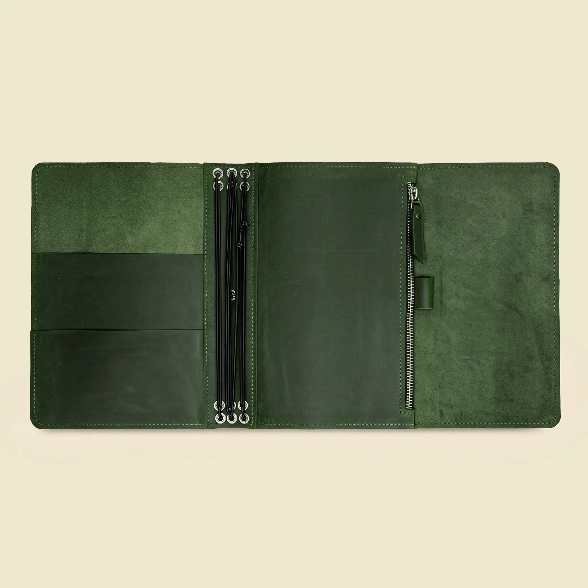 Leather notebook holder featuring flexible internal bands and an integrated sketchbook section.