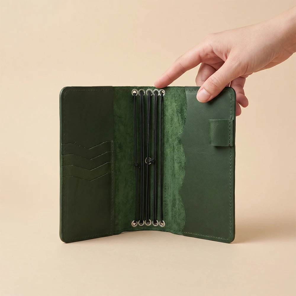 Genuine leather journal cover featuring inner pockets and five elastic inserts.